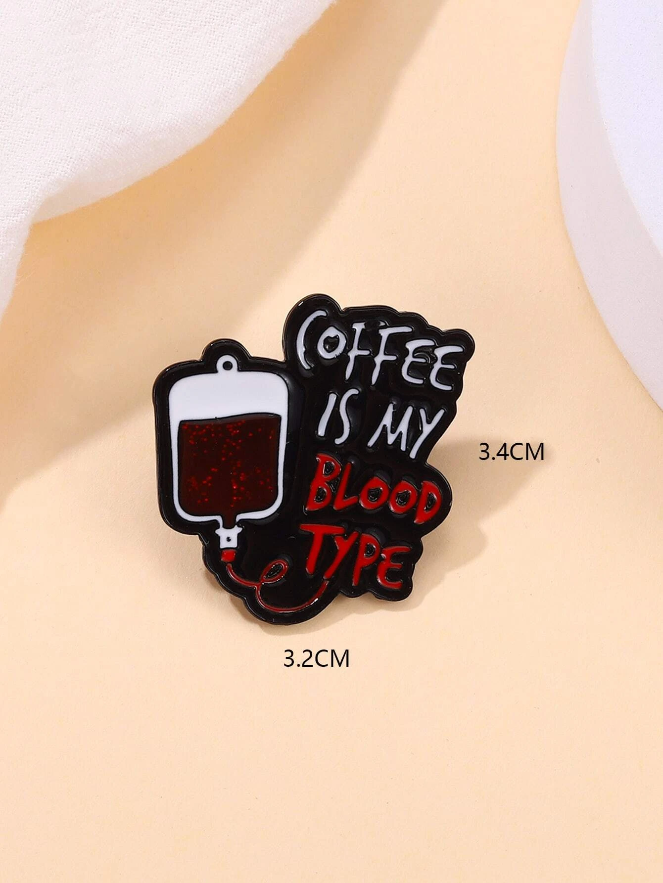 Brooch with intricate slogan detailing, adding a touch of meaningful expression and style to your attire.