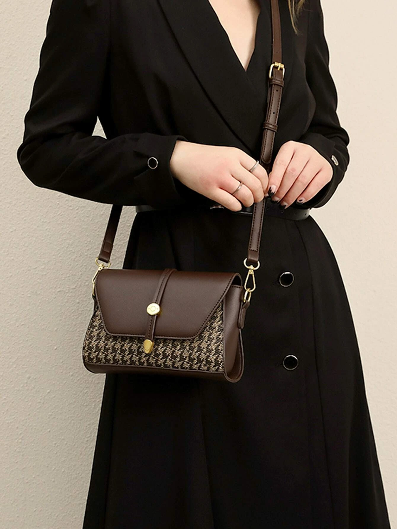 Mini square bag with houndstooth pattern flap. This accessory combines classic design with modern elements, offering a chic and stylish way to carry your essentials.