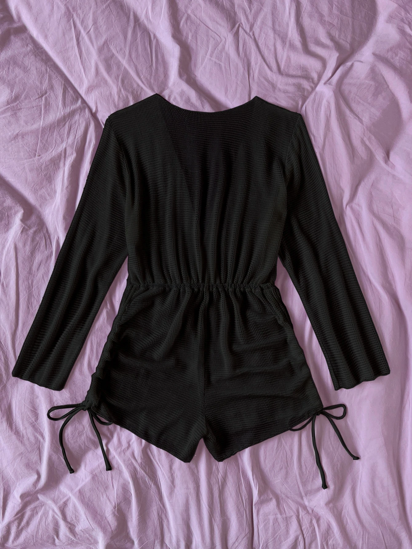 Hollow out drawstring side cover-up, a trendy and adjustable beachwear accessory. This cover-up features intricate hollow-out detailing and drawstring sides for customizable fit. Its unique design adds a touch of texture and style, perfect for layering over swimwear. The adjustable drawstring sides allow for versatile styling, making it a fashionable choice for your beach outings.