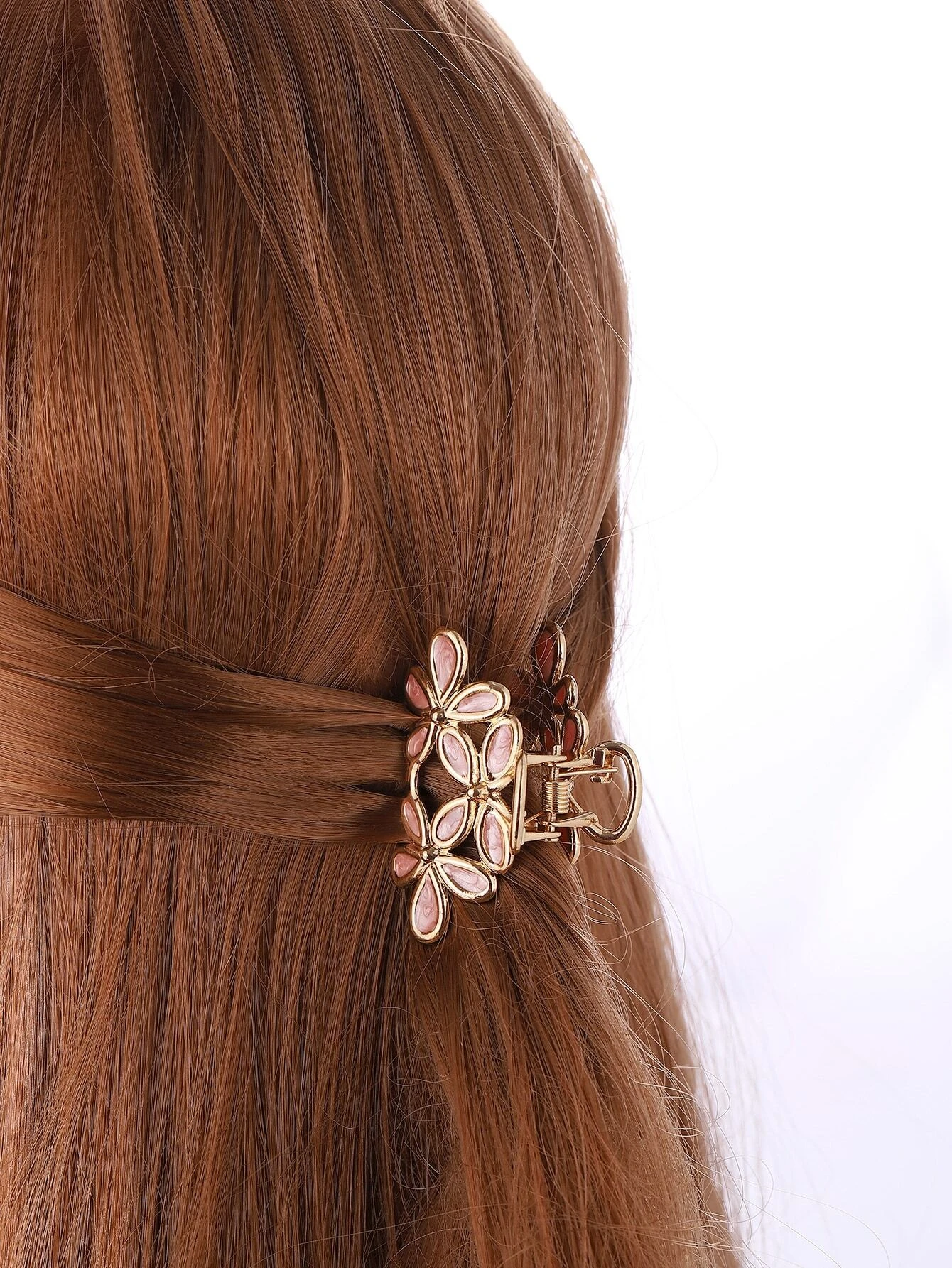 A set of three hair claws with flower designs, providing a stylish and functional way to secure your hair in place.