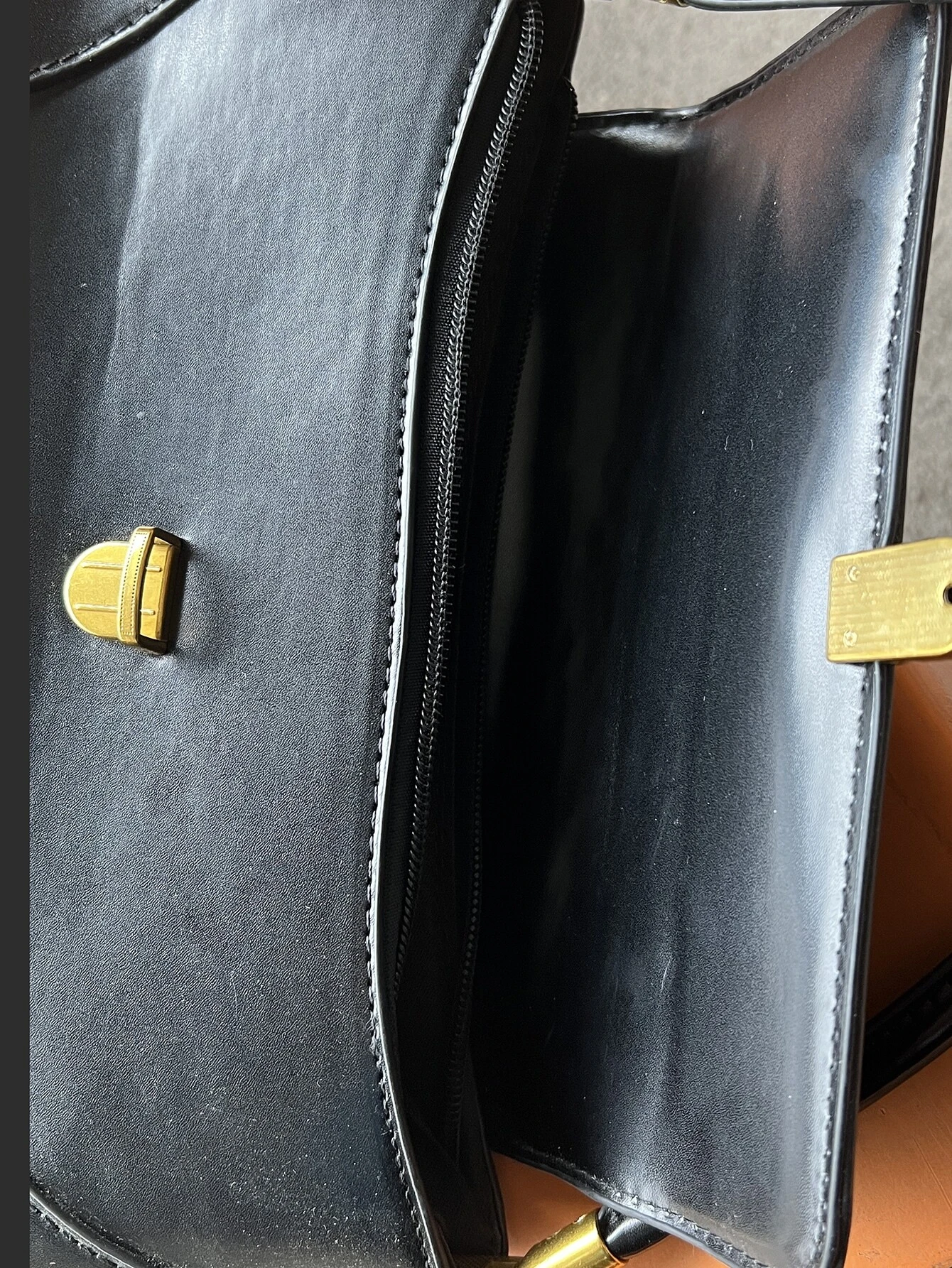 Flap baguette bag with minimalist design. This accessory offers a sleek and stylish way to carry your essentials, embodying modern elegance and functionality.