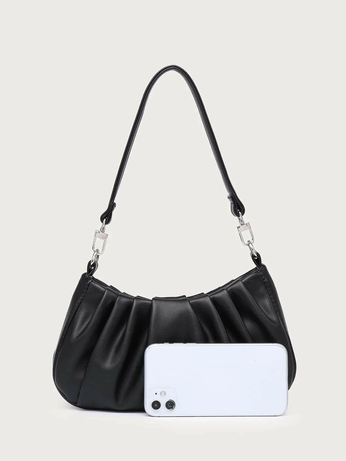 Shoulder bag with minimalist ruched design. This accessory offers a chic and stylish way to carry your essentials, combining modern simplicity with a touch of texture."