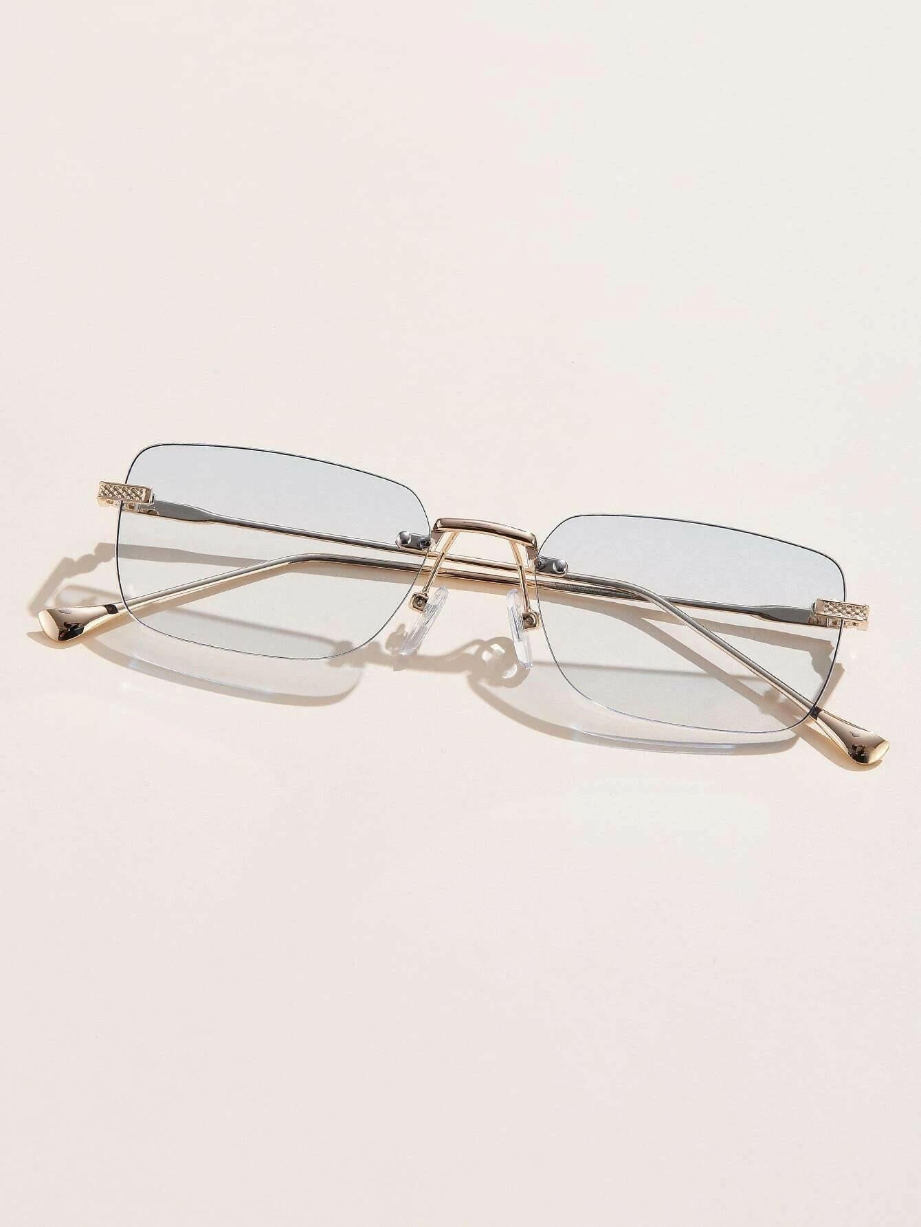 Square Rimless Sunglasses with a sleek and minimalist design. These sunglasses feature square-shaped lenses held by a rimless frame, offering a chic and lightweight option for sun protection and style.