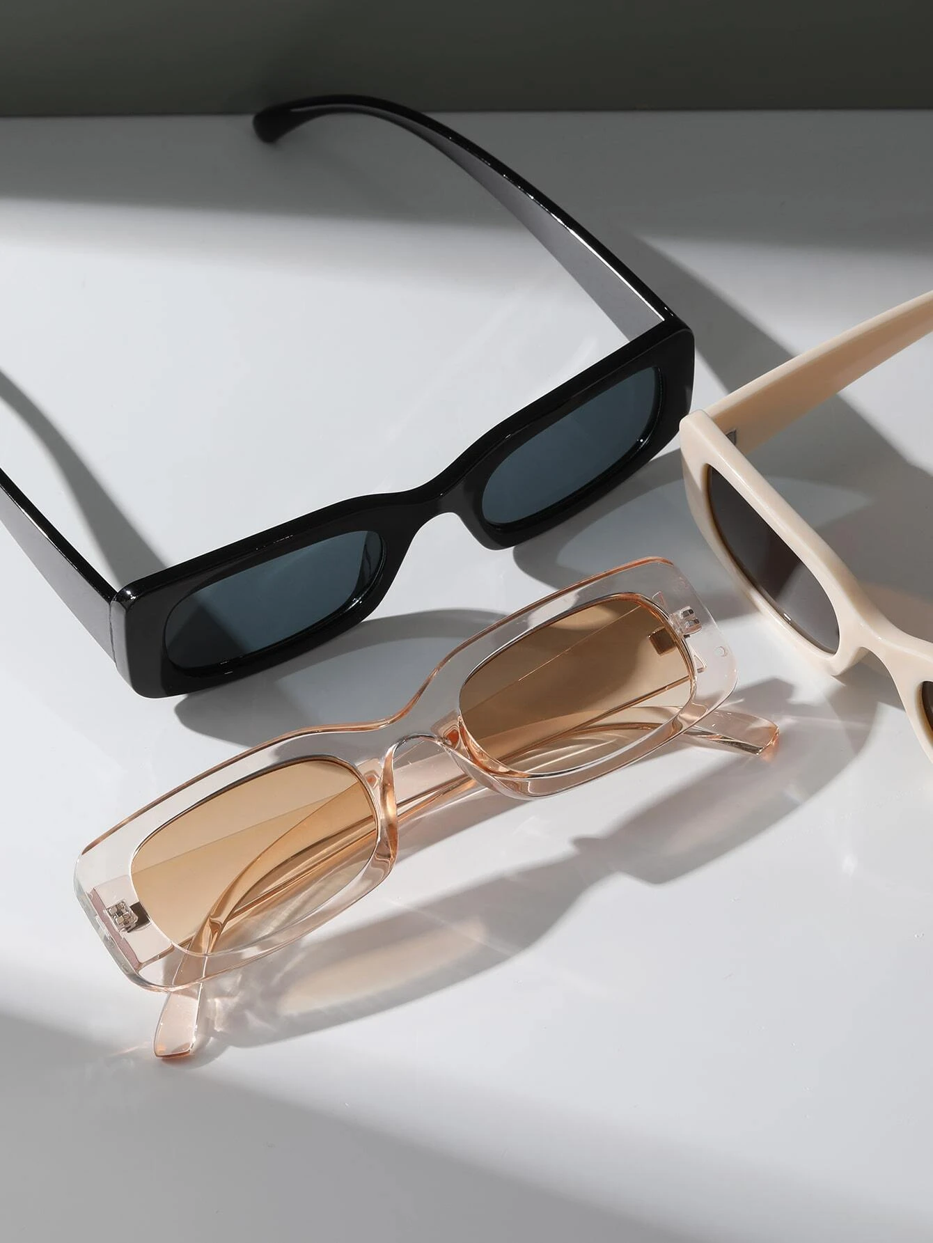Three pairs of Square Frame Sunglasses featuring different color combinations. Square frames add a touch of boldness to your accessory collection while providing essential sun protection.