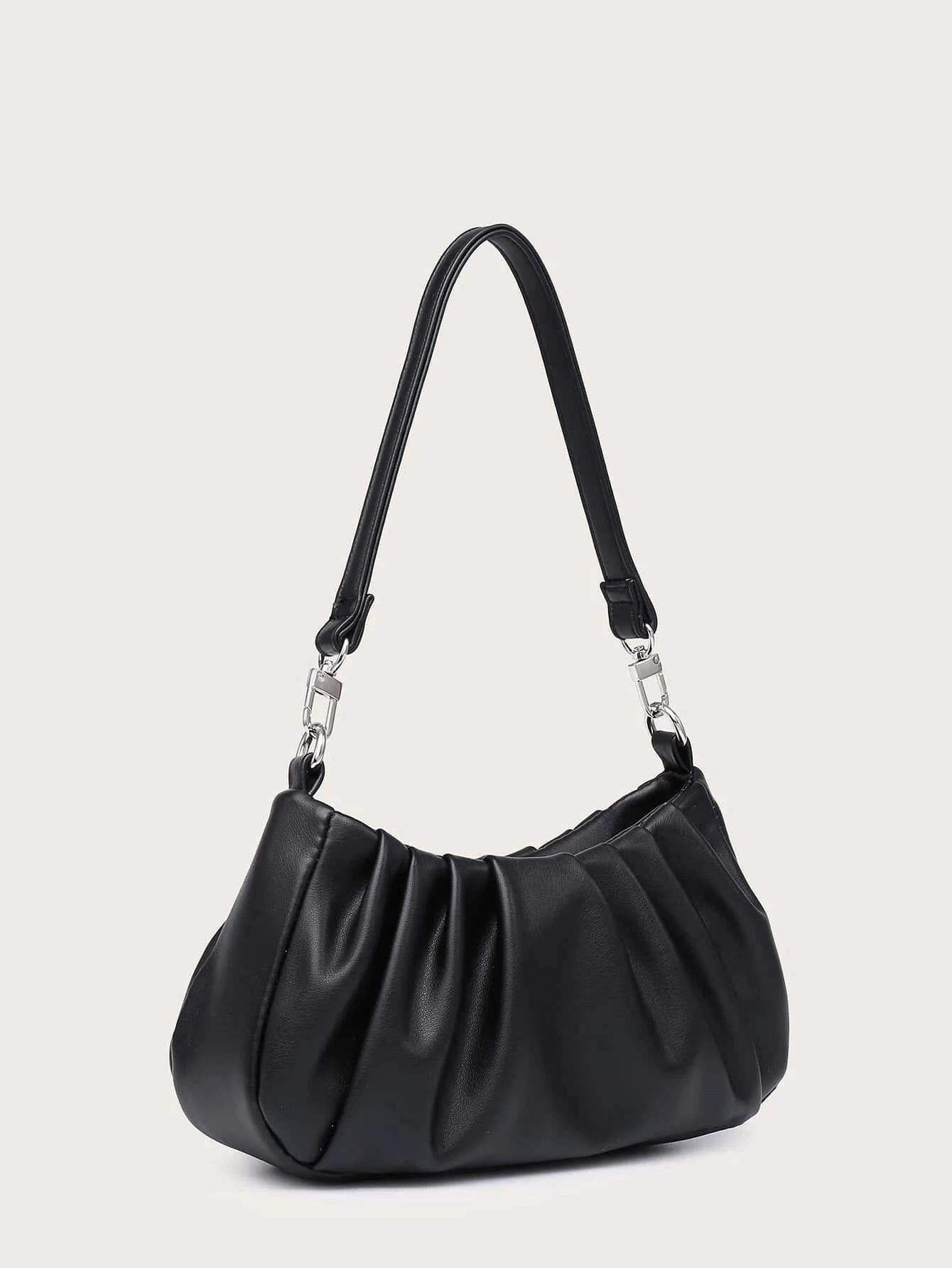 Shoulder bag with minimalist ruched design. This accessory offers a chic and stylish way to carry your essentials, combining modern simplicity with a touch of texture."