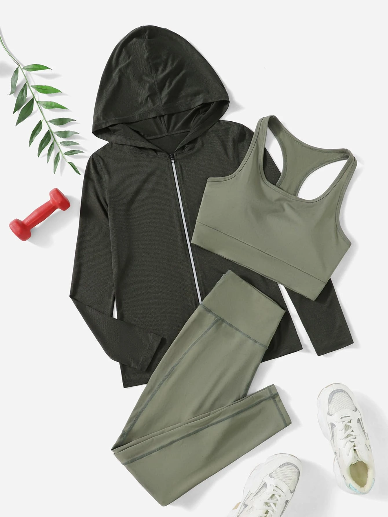 Image of a 3-piece breathable sports set. The set includes a top, leggings, and matching accessories, all crafted from breathable materials, providing comfort and functionality for various physical activities.