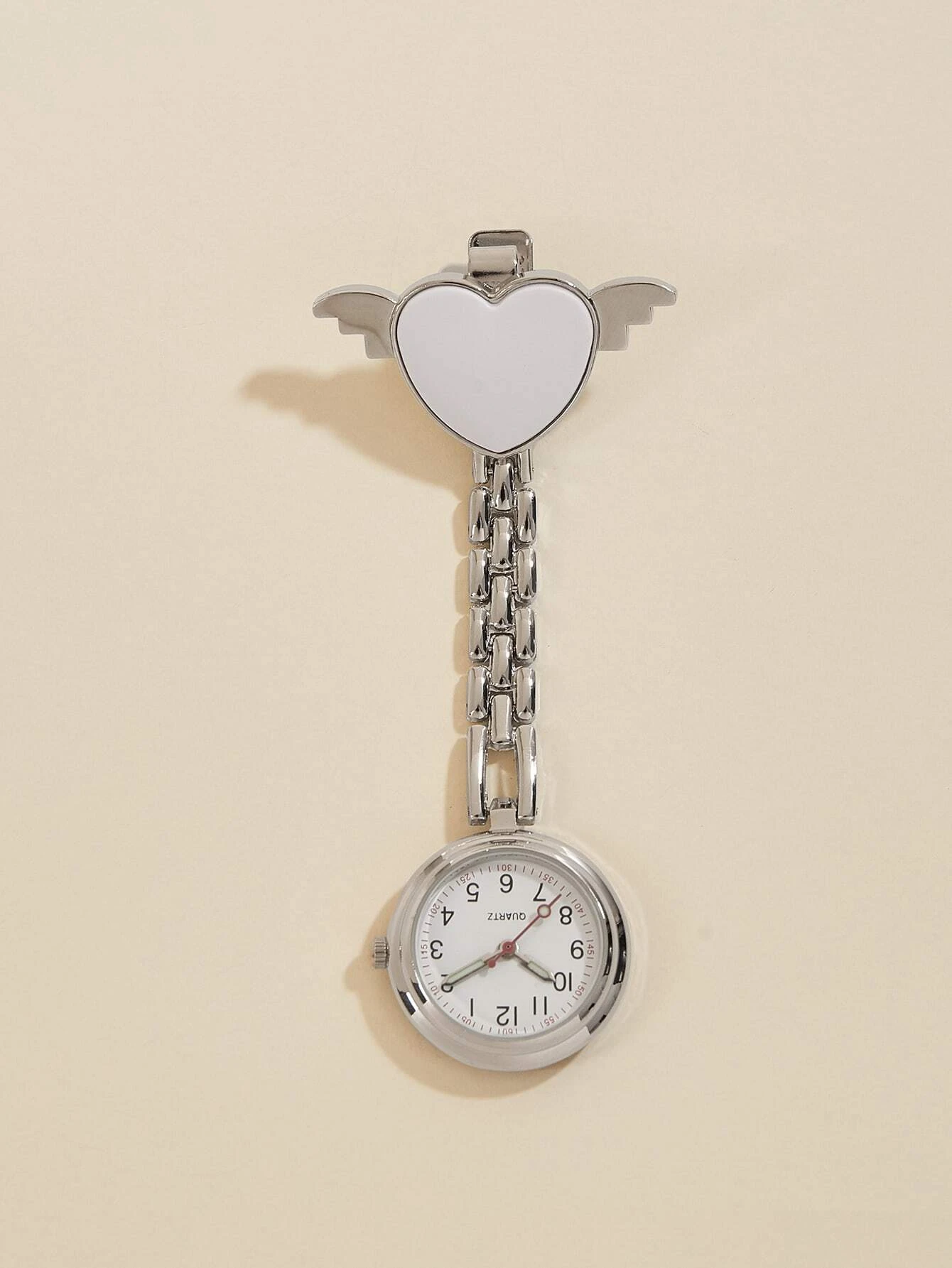 Quartz watch brooch featuring a heart and nurse design, combining style and functionality for a unique accessory suitable for healthcare professionals.