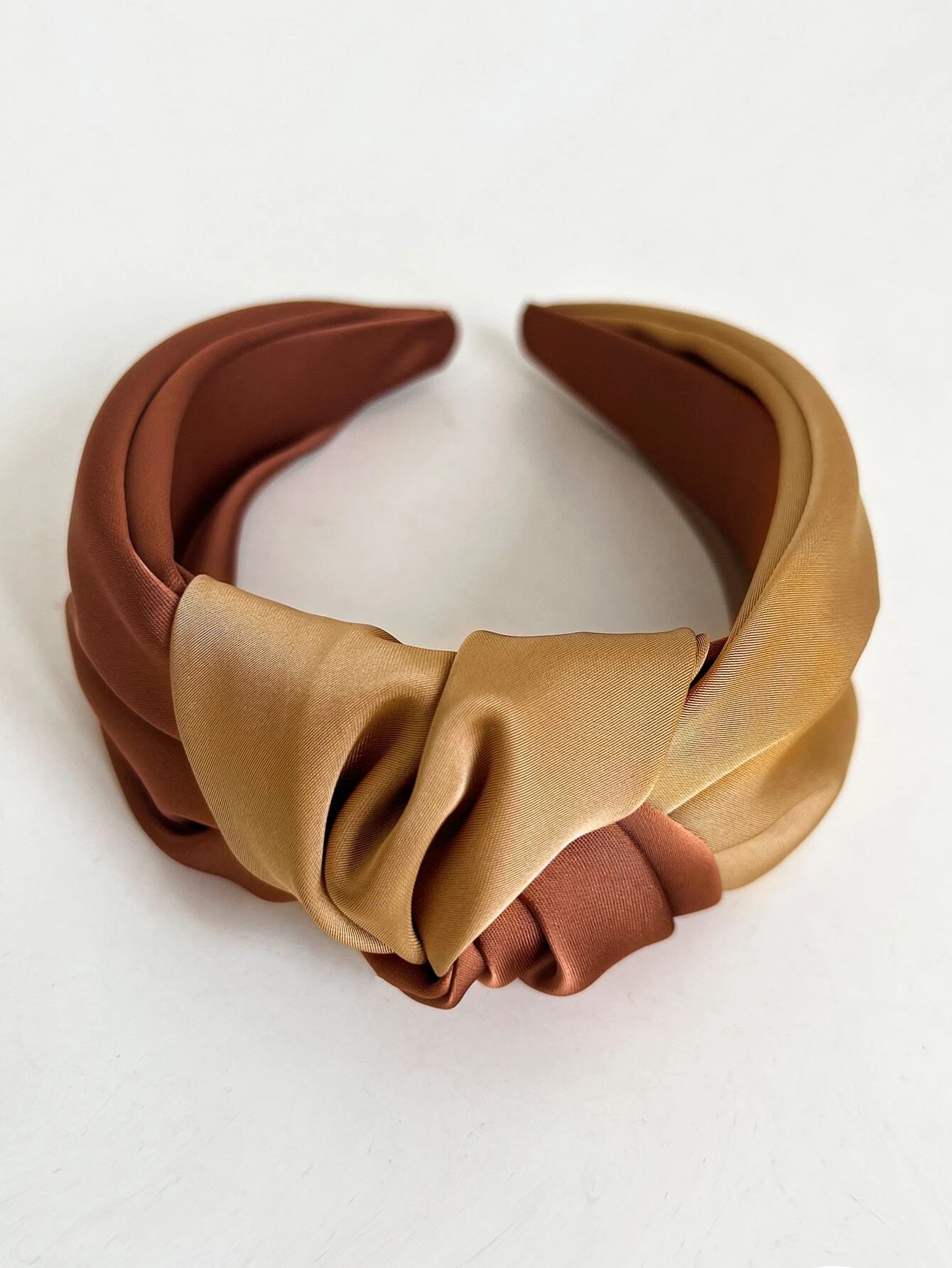 Wide headband with a two-tone knot detail, providing a stylish and eye-catching accessory to enhance your hair look.