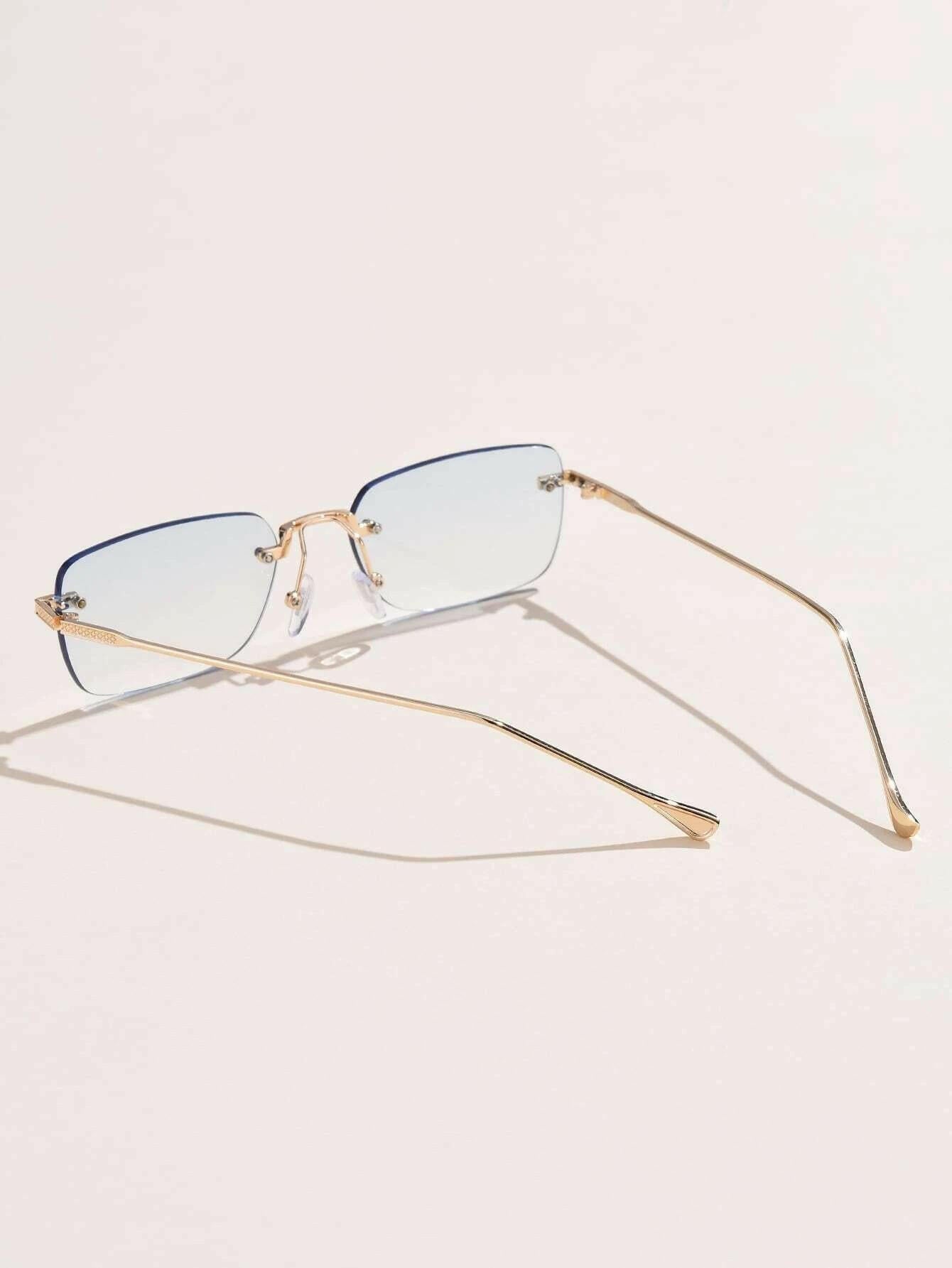 Square Rimless Sunglasses with a sleek and minimalist design. These sunglasses feature square-shaped lenses held by a rimless frame, offering a chic and lightweight option for sun protection and style.