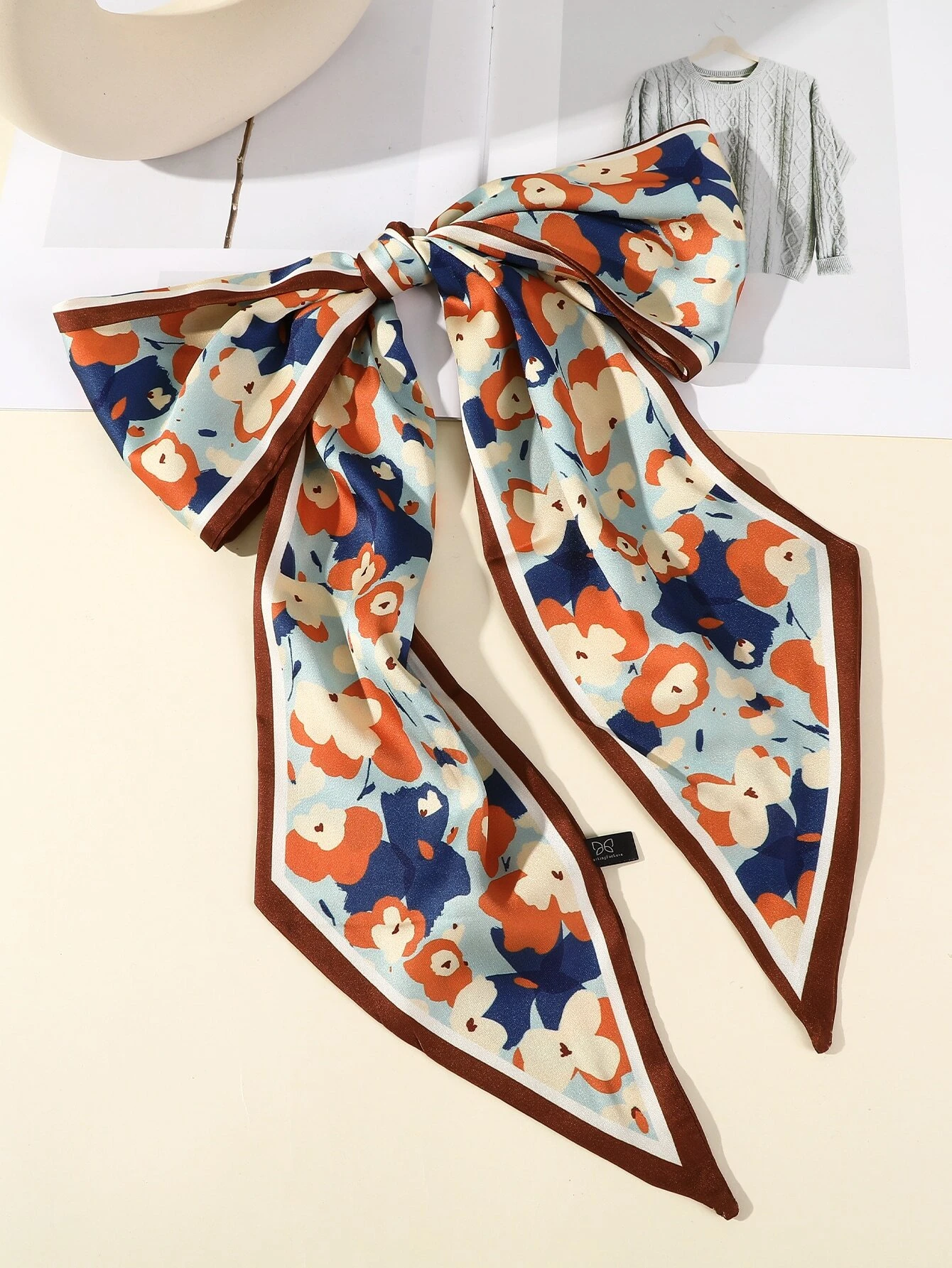 Hair band featuring a floral pattern, adding a touch of nature-inspired charm to your hairstyle.